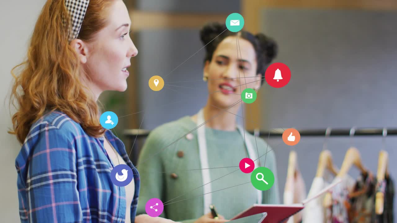 Left stylist showing, tapping tablet making icons rising grouping near right aid noting retail rack