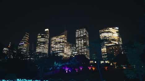 buildings tracking to led light display in sydney botanic garden for vivid in slow motion