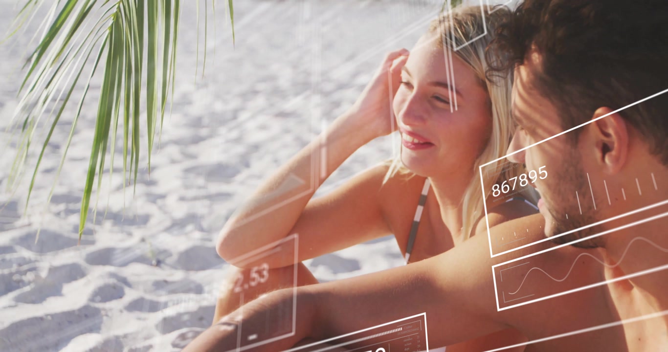 Pair sitting on sunlit sand with technology sequence unfolding HUD overlays fading over them