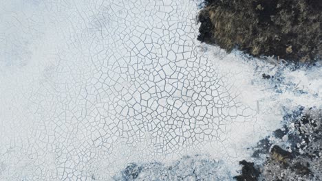 dried up white silica mud at run off pool from geothermal power plant, top down