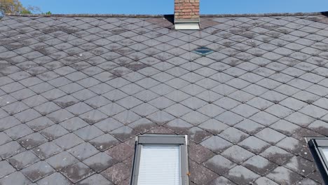 Old-Eternit-Roof-Of-A-House-With-Brick-Chimney-During-Sunny-Day