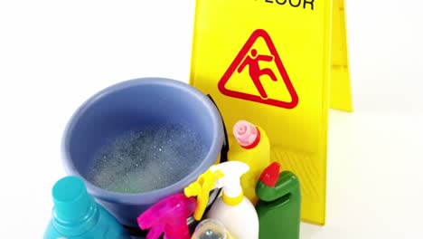 various housekeeping supplies with caution sign