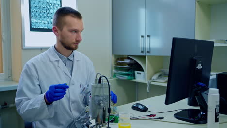 male research scientist. health care researcher working in science laboratory