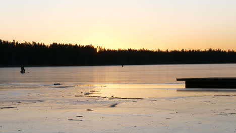 thin ice early morning with golden sunrise, static shot