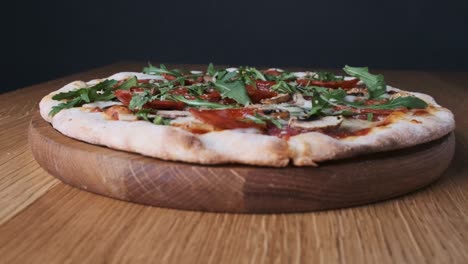 appetizing pizza on a wooden board in a restaurant