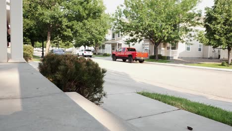 Man-walking-down-porch-steps-and-leaving-home-with-peaceful-neighborhood-in-background