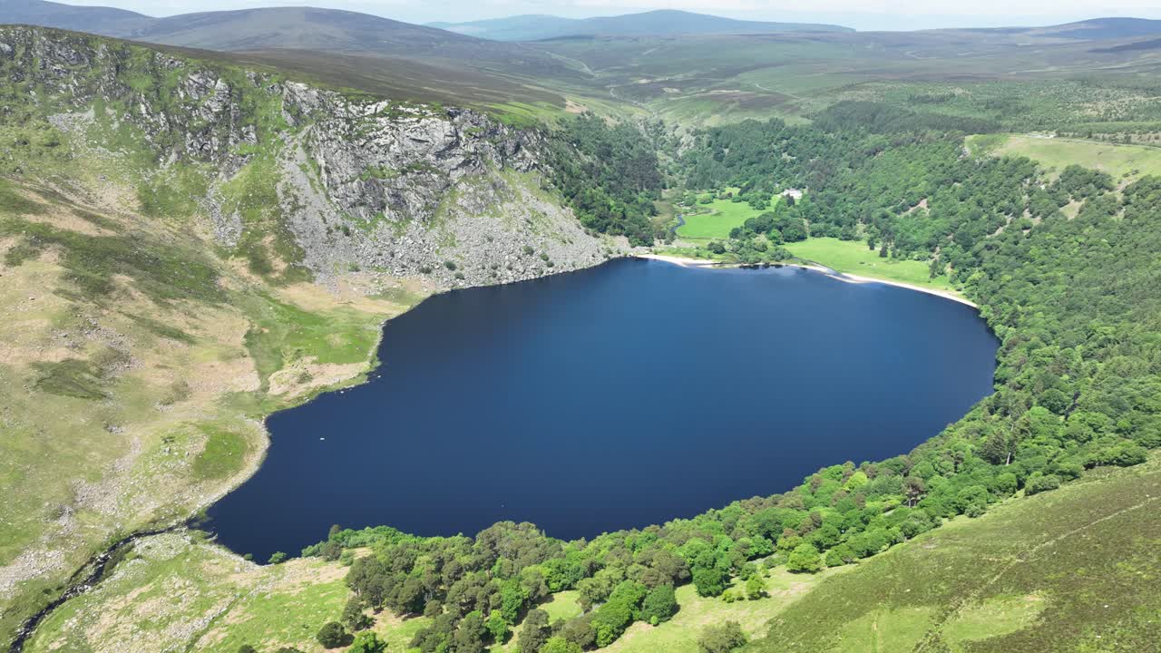 ireland epic Locations drone circling Lough Tay in The Wicklow Mountains stunning view of this popular beauty spot on a perfect summer day