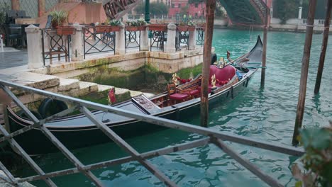 venetian gondolas on misty canal at dawn, italy