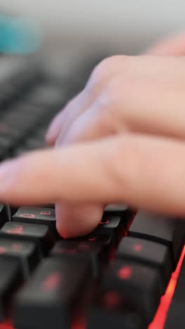 a video shows someone typing on a keyboard focusing on finger movement. this video features someone typing on a sleek keyboard, highlighting their rhythmic finger movements and glowing red keys, embodying productivity
