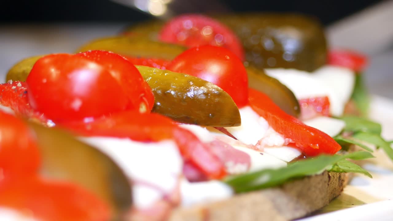 Open sandwich with pickles and tomatoes