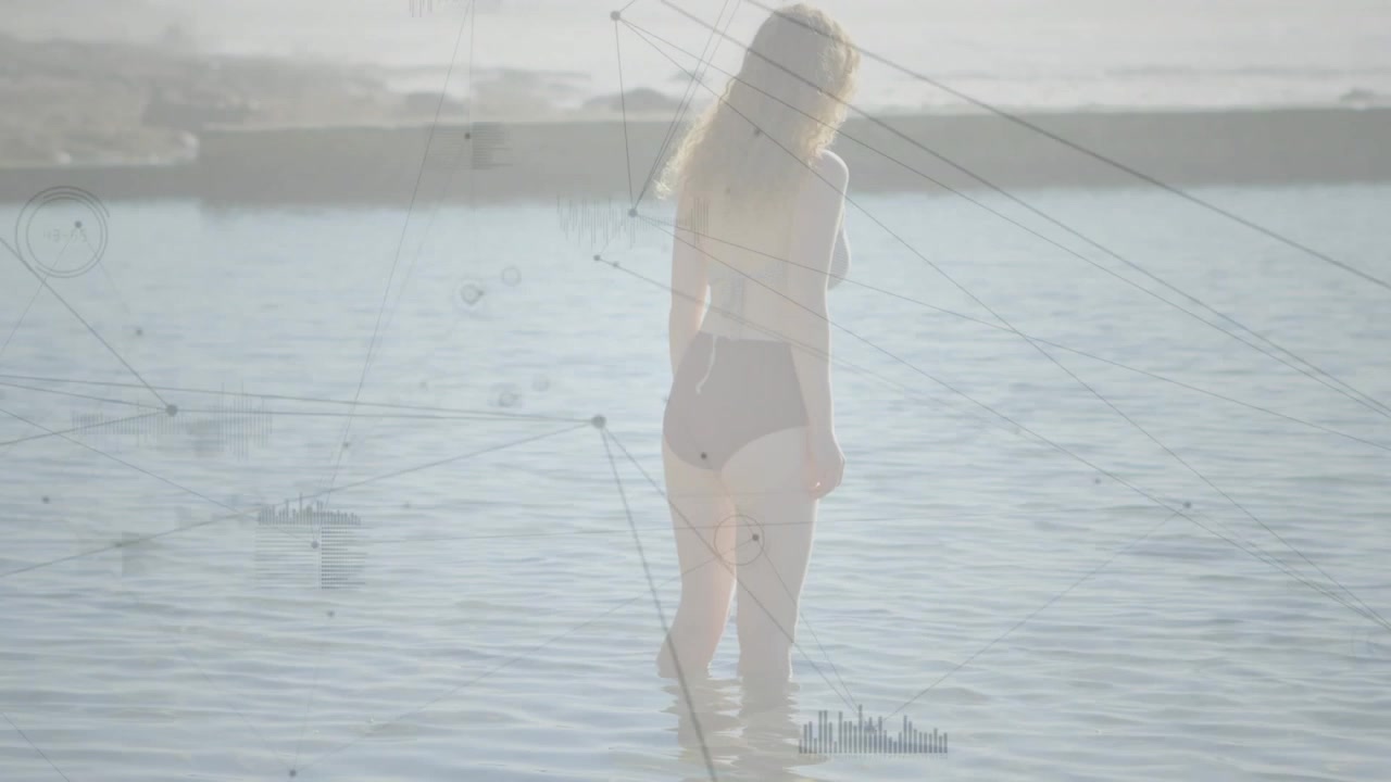Sunlight causing digital network nodes and lines animating around woman wading in sea for tech data