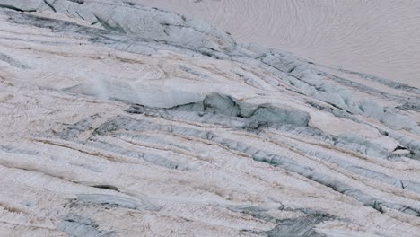 valmalenco, italy - the dense ice covering the surface of the fellaria glacier - close up