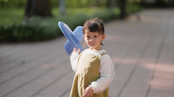 Child with blue airplane
