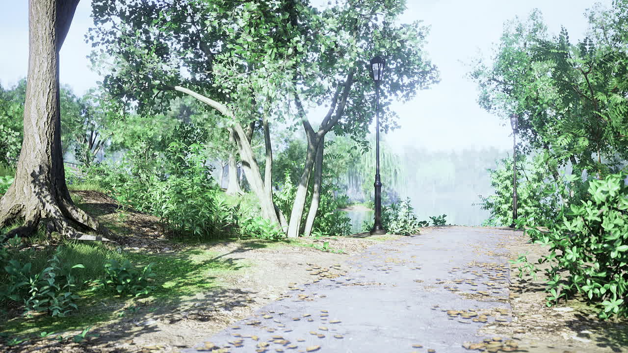 Lush green pathway leading to tranquil water view in a serene park