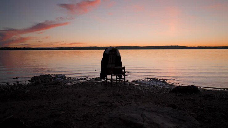 Lonely Chair at Sunset on the Beach