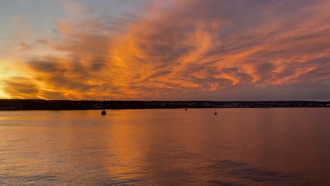 beautiful sunset reflected on the water with fiery tones