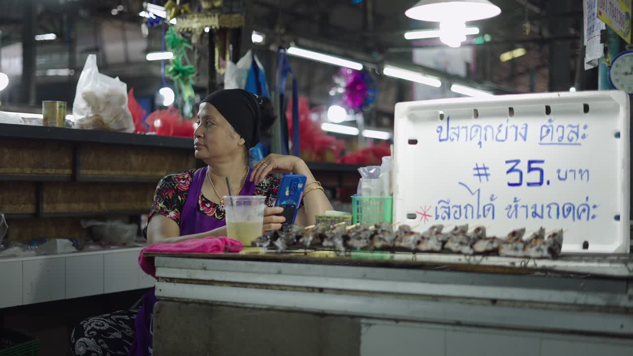 Woman selling fish at a market