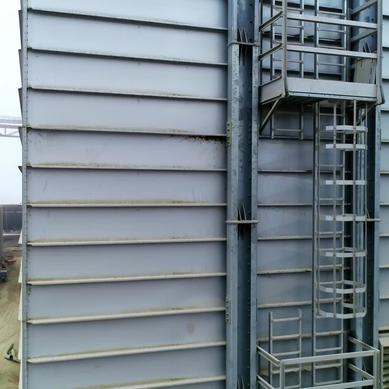 Aerial view of huge industrial storehouse. Big elevator metal construction storage