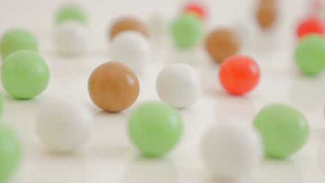 colorful background made of round candy bonbon on white 4k