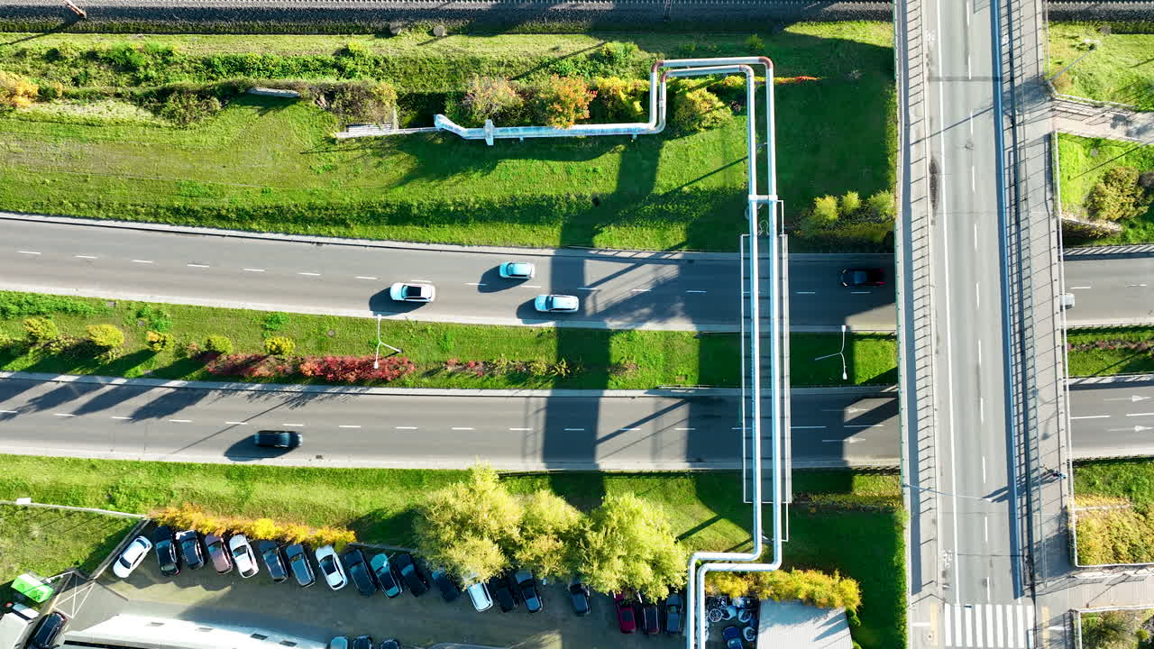Drone shot of multilane city roads and overpass bridge with moving vehicles in Gdynia, Poland
