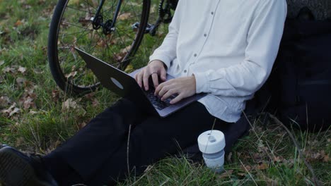 person working on a laptop in a park