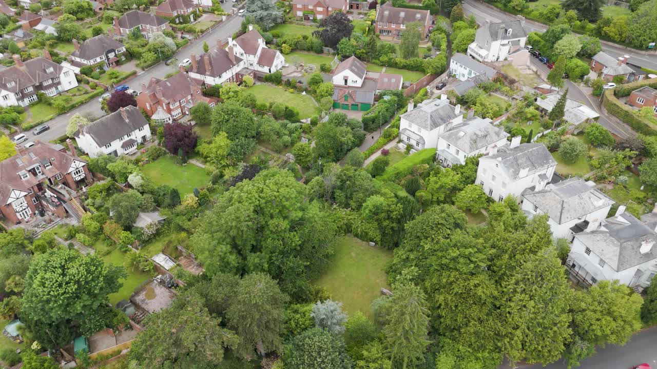 Drone fly in of grand white Georgian detached town houses, highlighting elegance and architectural detail in the UK