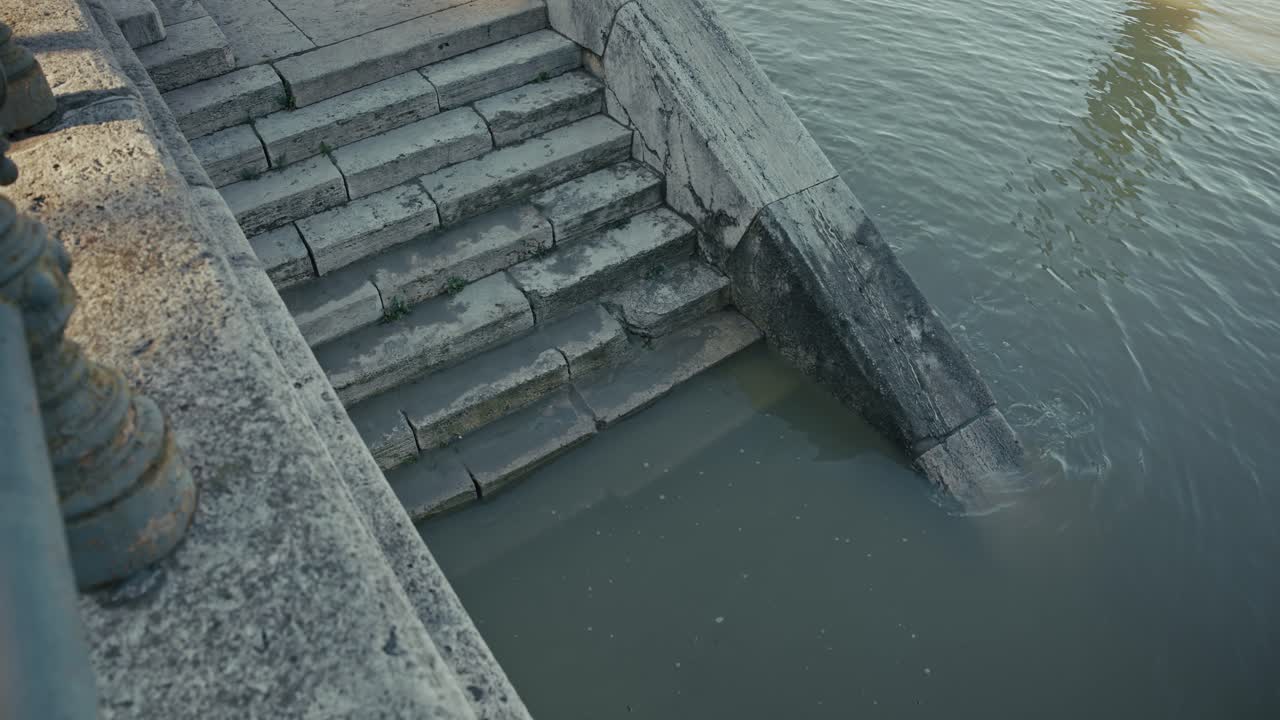 Stone staircase partially submerged in water during the Budapest Flood 2024, leading into the Danube