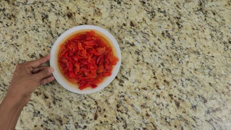 picked red pepper in a bowl, serivng precut vegetables