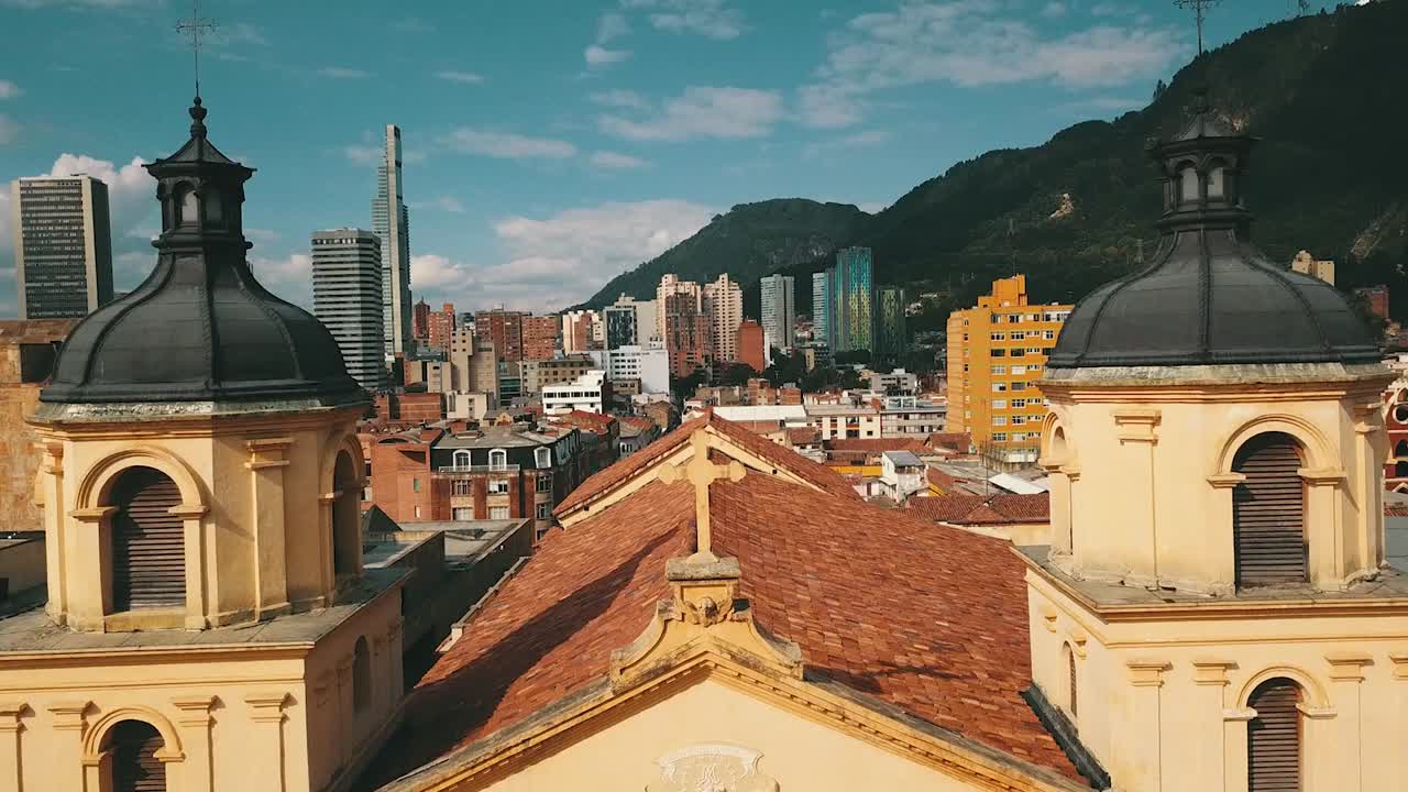Front view of "The Church of San Agustín" in Bogotá, Colombia, with Mount Monserrate in the background