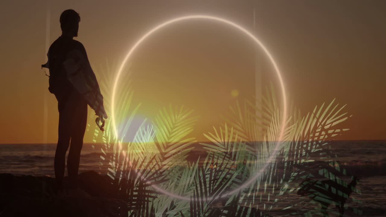 Man standing facing sunset as graphic ring and palm fronds appearing behind silhouette for design