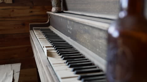 beer glass bottle on an old piano inside the saloon in pioneertown, california