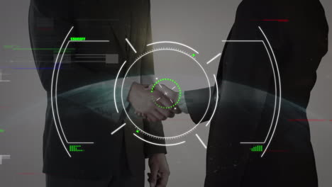 scope scanning over mid section of businessman and businesswoman shaking hands against globe