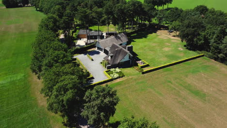 aerial view of a modern farmhouse in a rural landscape