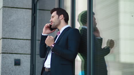 closeup businessman talking phone outside. business man using smartphone