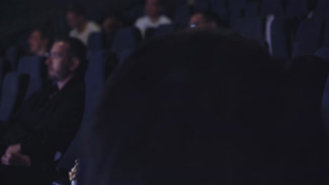 woman watching a movie in a movie theater