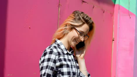 young woman talking on mobile phone outdoor 4k