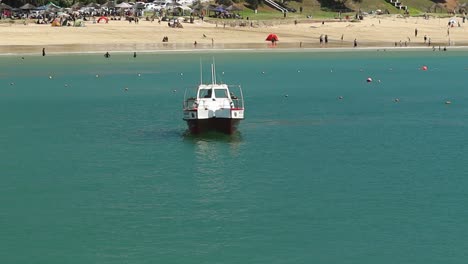 small fisherboat navigating into harbour