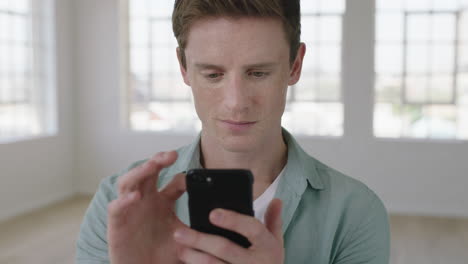 close-up-portrait-of-young-red-head-man-texting-browsing-using-smartphone-mobile-technology-smiling-enjoying-social-media-communication