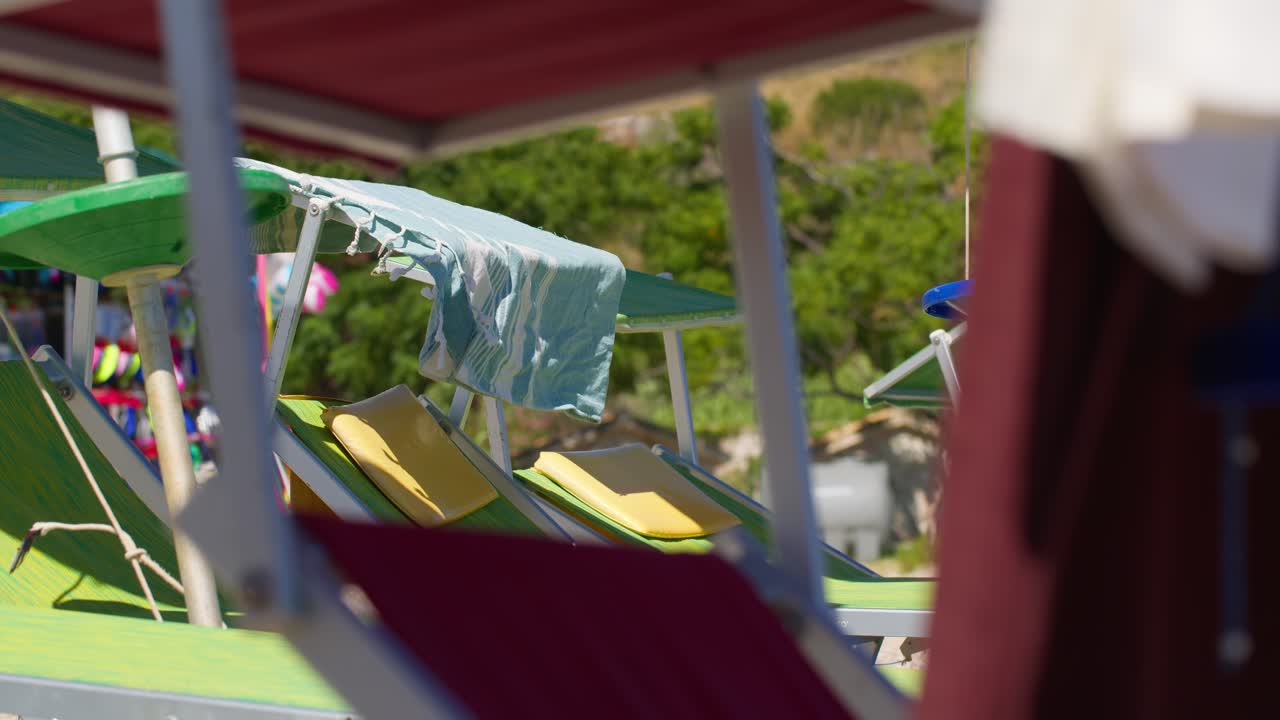 Relaxing sunbeds at Guidaloca Beach, Sicily, summer vibe, leisure
