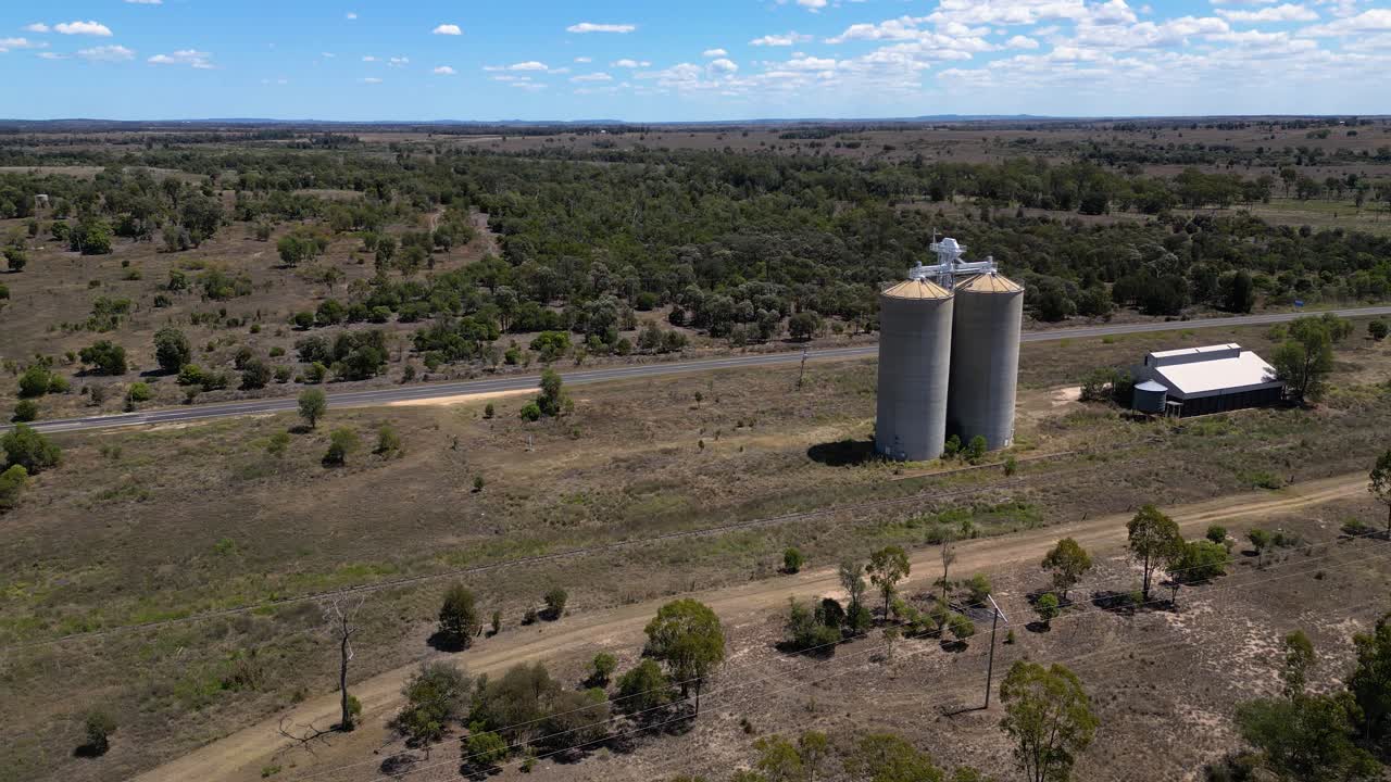 Reversing aerial views over grain silos just outside Wandoan, Queensland.