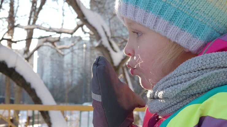 Outdoor winter portrait of little girl