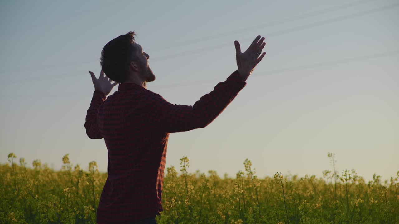 Happy Farmer in Rapeseed Field