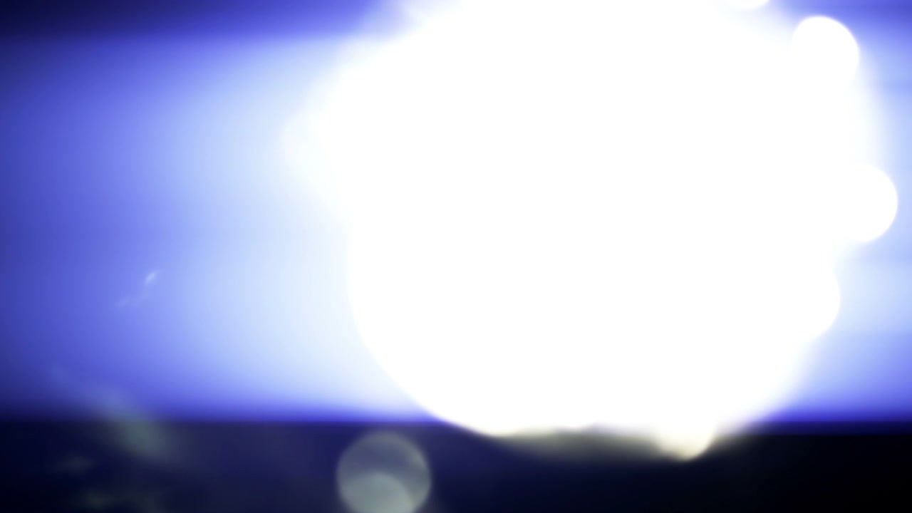 Abstract Blue Light Leaks and Lens Flares on Black Background