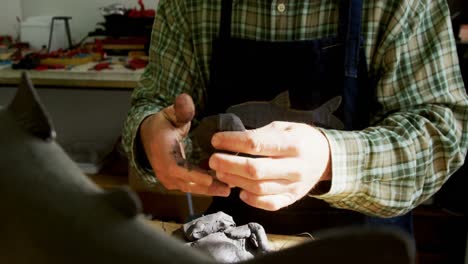 craftsman working on clay sculpture 4k