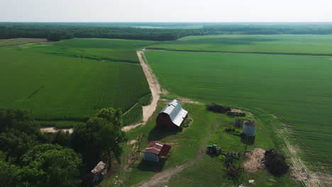 panoramic view of farm fields and barn in biscoe, prairie county, arkansas, united states - aerial drone shot
