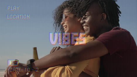 animation of text vibes over people by seaside