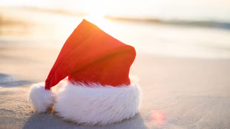 Animation-of-santa-hat-lying-on-snow-on-sunny-christmas-day