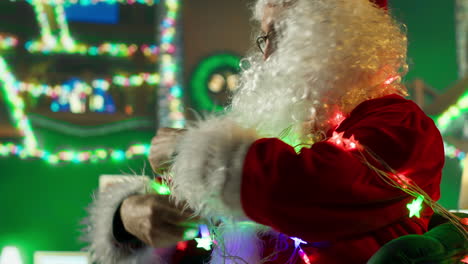 santa decorating christmas lights