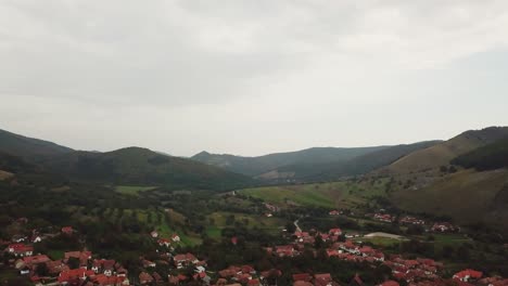 Amazing-green-hills-beyond-the-iconic-village-of-Torocko,-also-known-as-Rimetea,-Romania