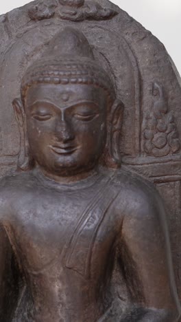 buddha statue displayed in edinburgh museum exhibit